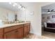 Double vanity bathroom with granite countertops at 1414 Thunderbird Rd, Davenport, FL 33896