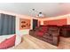 Home theater with brown reclining seats and projector at 1414 Thunderbird Rd, Davenport, FL 33896