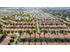Aerial view of a large community with numerous houses and a resort-style pool at 1414 Thunderbird Rd, Davenport, FL 33896