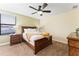 Bedroom with full bed, nightstands, and neutral decor at 1414 Thunderbird Rd, Davenport, FL 33896