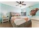 Bedroom with Moana theme, featuring a ceiling fan and TV at 1414 Thunderbird Rd, Davenport, FL 33896