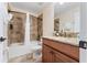 Bathroom with shower/tub combo, granite vanity, and tile flooring at 1414 Thunderbird Rd, Davenport, FL 33896