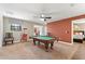Game room featuring a pool table and adjacent bedroom at 1414 Thunderbird Rd, Davenport, FL 33896