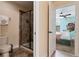 Bathroom with shower and toilet, next to a bedroom at 1414 Thunderbird Rd, Davenport, FL 33896