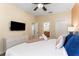 Comfortable bedroom with a king-size bed and ensuite bathroom at 1414 Thunderbird Rd, Davenport, FL 33896