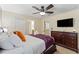 Bedroom with TV, dresser, and ensuite bathroom access at 1414 Thunderbird Rd, Davenport, FL 33896