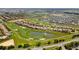 Aerial view of community homes and golf course at 1414 Thunderbird Rd, Davenport, FL 33896