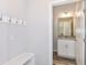 Clean bathroom with white vanity, gray countertop, and tiled floor at 2260 Sirena Ln, Mount Dora, FL 32757