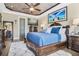 Main bedroom with a large bed and plenty of natural light at 684 Sanctuary Golf, Apopka, FL 32712