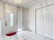 Bright entryway with tile flooring, a coat closet, and front door at 2281 E Union Cir, Deltona, FL 32725