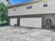 Two-car garage with a spacious concrete driveway at 2281 E Union Cir, Deltona, FL 32725