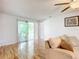 Living room with hardwood floors and sliding doors to patio at 2281 E Union Cir, Deltona, FL 32725