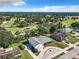 Aerial view of a house on a golf course with a circular driveway at 2281 E Union Cir, Deltona, FL 32725