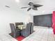 Dining area with glass table, black chairs, and a ceiling fan at 2281 E Union Cir, Deltona, FL 32725