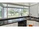 Kitchen features a large window overlooking a scenic view and modern appliances at 2281 E Union Cir, Deltona, FL 32725