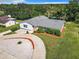 Aerial view of a single-story home with a circular driveway and landscaped yard at 2281 E Union Cir, Deltona, FL 32725