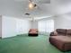 Spacious bonus room with green carpet and ample natural light at 2281 E Union Cir, Deltona, FL 32725