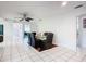 Dining room with glass table, black chairs, and ceiling fan at 2281 E Union Cir, Deltona, FL 32725