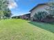 Large backyard with lush green grass and mature trees at 2281 E Union Cir, Deltona, FL 32725