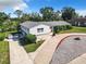 Newly renovated home with a landscaped yard at 2281 E Union Cir, Deltona, FL 32725