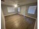 Bright and airy living room with neutral walls and wood-look flooring at 5146 Liming Ave, Orlando, FL 32808