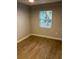 Spacious bedroom with neutral walls and wood-look flooring at 5146 Liming Ave, Orlando, FL 32808
