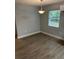 Simple dining area with neutral walls and wood-look flooring at 5146 Liming Ave, Orlando, FL 32808