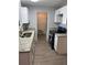 Modern kitchen with white shaker cabinets, granite counters, and stainless steel appliances at 5146 Liming Ave, Orlando, FL 32808