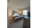 Bright bedroom with a queen bed and neutral color palette at 226 Macaulays Cv, Haines City, FL 33844