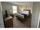 Bedroom with a queen bed and a modern dresser at 226 Macaulays Cv, Haines City, FL 33844
