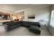 Spacious living room with a large sectional sofa and open floor plan at 226 Macaulays Cv, Haines City, FL 33844