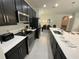Modern kitchen with stainless steel appliances and white counters at 226 Macaulays Cv, Haines City, FL 33844