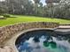 Relaxing community pool with gazebo and lounge chairs at 204 Crown Oaks Way # 201, Longwood, FL 32779