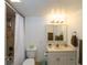 Clean bathroom with a single sink vanity and shower/tub combo at 204 Crown Oaks Way # 201, Longwood, FL 32779