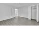 Bright bedroom with wood-look floors and ample closet space at 295 S Oak Ave, Bartow, FL 33830