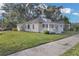 Charming bungalow with a well-maintained lawn and inviting front porch at 295 S Oak Ave, Bartow, FL 33830