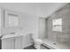 Updated bathroom with a walk-in shower and grey tile at 295 S Oak Ave, Bartow, FL 33830