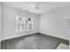 Well-lit bedroom with hardwood floors and ample natural light at 295 S Oak Ave, Bartow, FL 33830