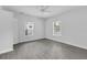 Spacious bedroom with grey flooring and neutral walls at 295 S Oak Ave, Bartow, FL 33830