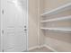 Entryway with coat hooks and shelves at 14895 Winkfield Ct, Winter Garden, FL 34787