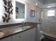 Updated bathroom with granite countertops, dual sinks, and a walk-in shower at 11540 Sandy Hill Dr, Orlando, FL 32821