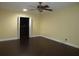 Bedroom with dark laminate flooring and a walk-in closet at 11540 Sandy Hill Dr, Orlando, FL 32821