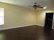 Bright bedroom with dark laminate wood floors and walk-in closet at 11540 Sandy Hill Dr, Orlando, FL 32821