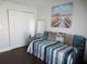 Guest bedroom with daybed, built-in shelving, and wood floors at 11540 Sandy Hill Dr, Orlando, FL 32821