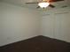Spacious bedroom with dark laminate floors and double closets at 11540 Sandy Hill Dr, Orlando, FL 32821