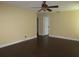 Spacious bedroom with dark wood floors and ceiling fan at 11540 Sandy Hill Dr, Orlando, FL 32821