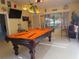 Fun game room features a pool table and tropical decor at 11540 Sandy Hill Dr, Orlando, FL 32821