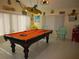 Bright and cheerful game room with a pool table at 11540 Sandy Hill Dr, Orlando, FL 32821
