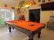 Pool table is the centerpiece of this fun game room at 11540 Sandy Hill Dr, Orlando, FL 32821