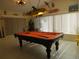 Game room with pool table and tropical decor at 11540 Sandy Hill Dr, Orlando, FL 32821